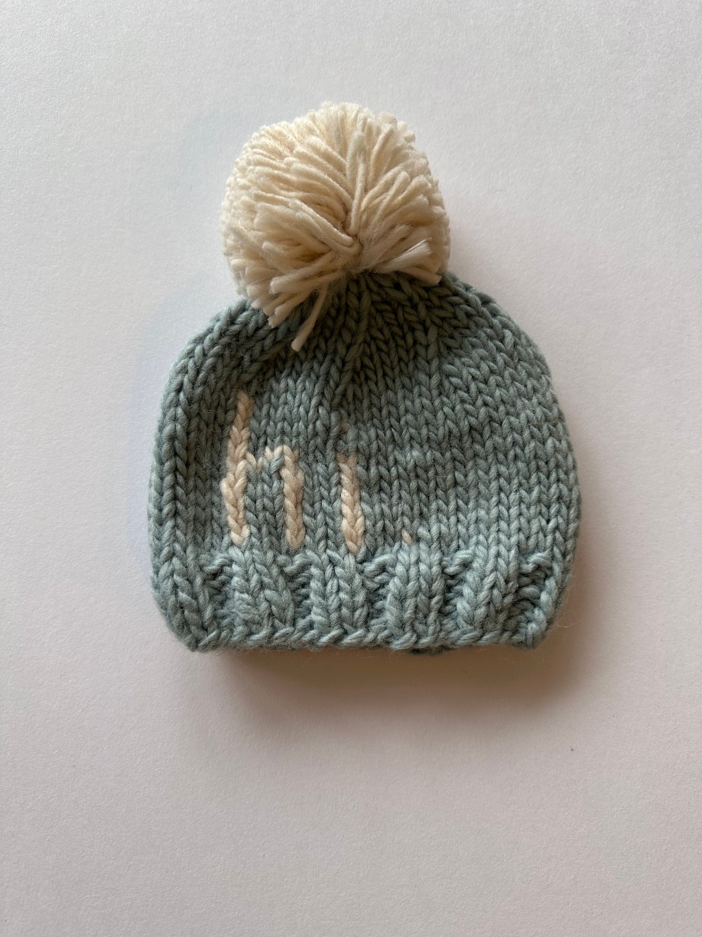 Hi. Sky blue hand knit beanie